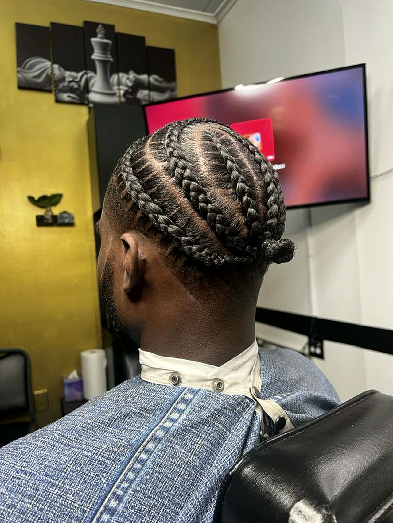 Braided style with a clean taper at Ivey League Barber